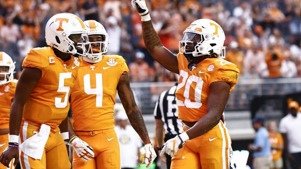 Tennessee running back Jaylen Wright (20) reacts to scoring a touchdown with quarterback Hendon Hooker (5) and wide receiver Cedric Tillman (4) during the first half of an NCAA college football game against Akron, Saturday, Sept. 17, 2022, in Knoxville, Tenn.