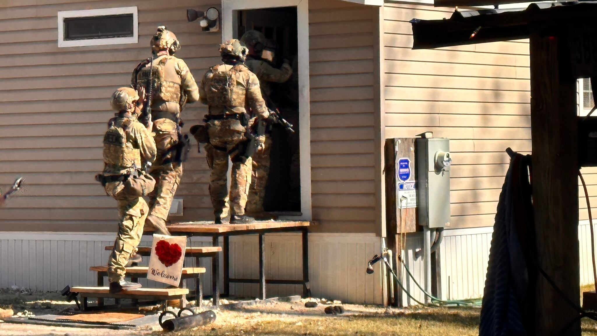 SWAT conducted a search warrant at a home in Lawtey and recovered over 20 guns and drugs.