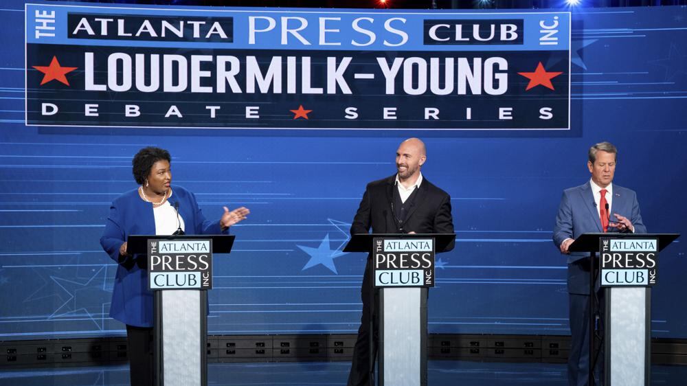 Democratic challenger Stacey Abrams, from left, Libertarian challenger Shane Hazel and Georgia Republican Gov. Brian Kemp debate during the Atlanta Press Club Loudermilk-Young Debate Series in Atlanta, Monday, Oct. 17, 2022.