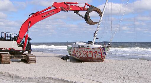 Crews came Tuesday to remove a sailboat that washed ashore on Jacksonville Beach in October.