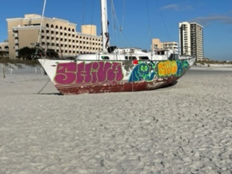 The sailboat, which washed ashore on Jacksonville Beach on Oct. 23, has become an eyesore and a target for graffiti.