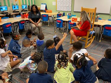 Action News Jax's Chandler Morgan reads to first-graders at YMCA Tiger Academy