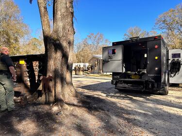 SWAT conducted a search warrant at a home in Lawtey and recovered over 20 guns and drugs.