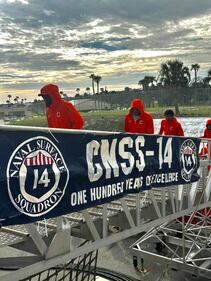 Clemson players going onboard the USS Jason Dunham.
