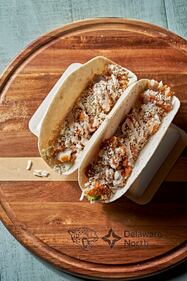 Fish Tacos: Cornmeal-breaded catfish on warm flour tortillas, topped with cabbage and chipotle aioli. Available at Duuuval Coastal Kitchen at Section 125.