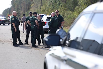 A suspect in a red truck who deputies say was pointing a gun at other cars on Interstate 95 southbound was taken to the hospital after crashing, the St. Johns County Sheriff’s Office said in a social post.