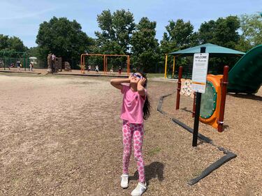 Students at Bartram Springs Elementary School take in the view of the 2024 solar eclipse.