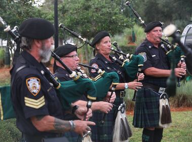 Police and Fire Pipes & Drums performed throughout the ceremony.