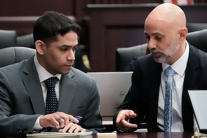 Defendant Mario Fernandez Saldana, left, talks with his Defense Attorney James Hill, before the start of jury selection in his murder trial Monday morning, August 10, 2026 in the Duval County Courthouse in Jacksonville, Fla. [Doug Engle/Florida Times-Union]