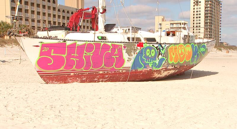 Crews came Tuesday to remove a sailboat that washed ashore on Jacksonville Beach in October.