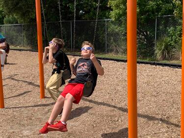 Students at Bartram Springs Elementary School take in the view of the 2024 solar eclipse.