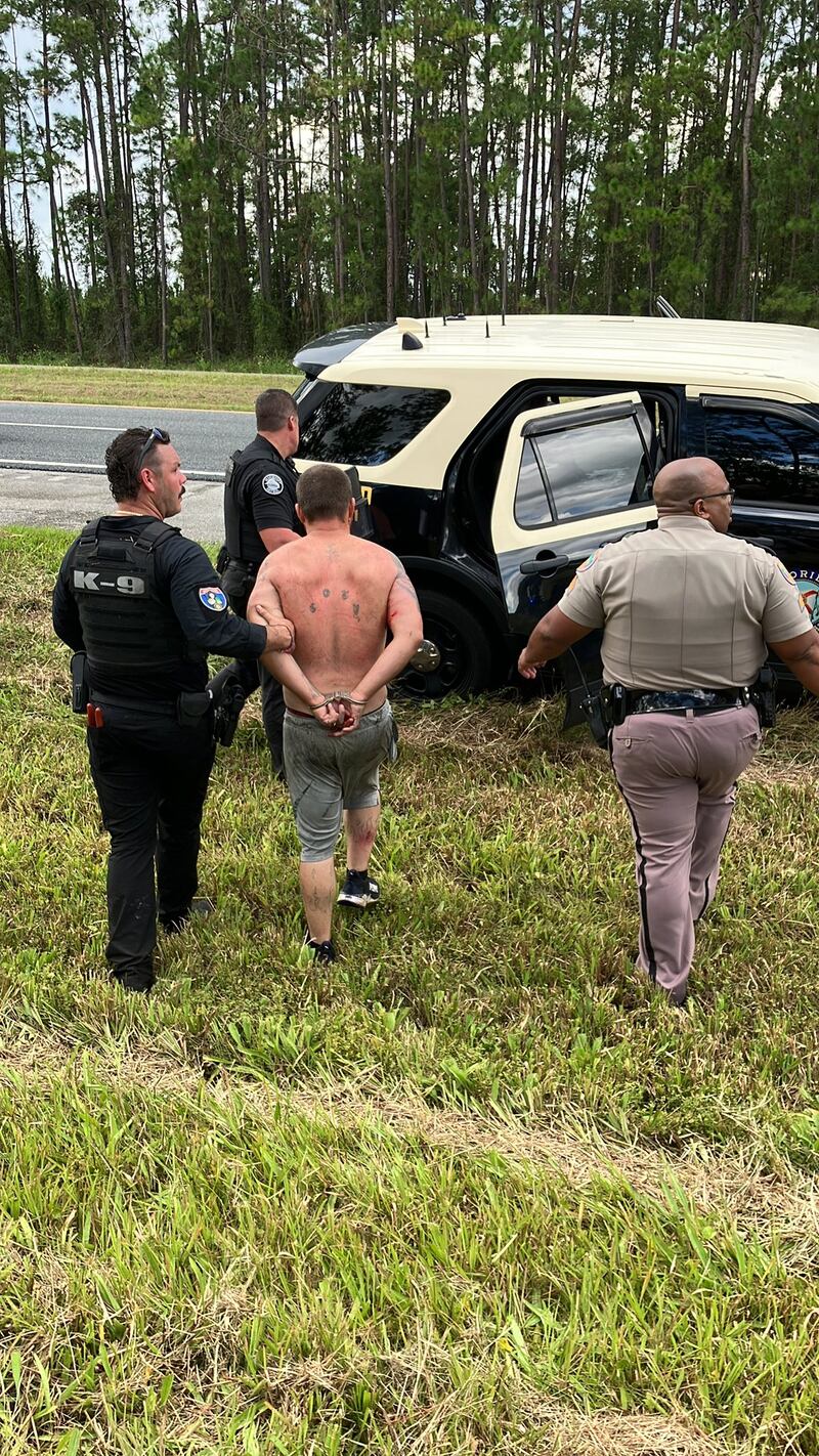 Florida Highway Patrol said it has captured an at-large suspect who ran into the woods off Interstate 10 East on Thursday morning.