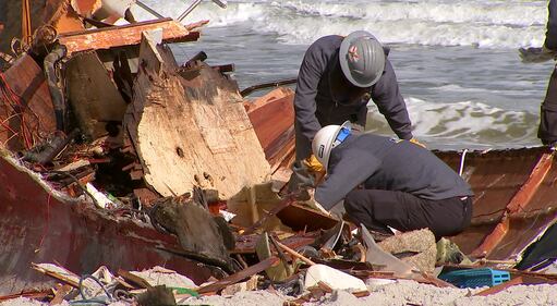 Crews came Tuesday to remove a sailboat that washed ashore on Jacksonville Beach in October.