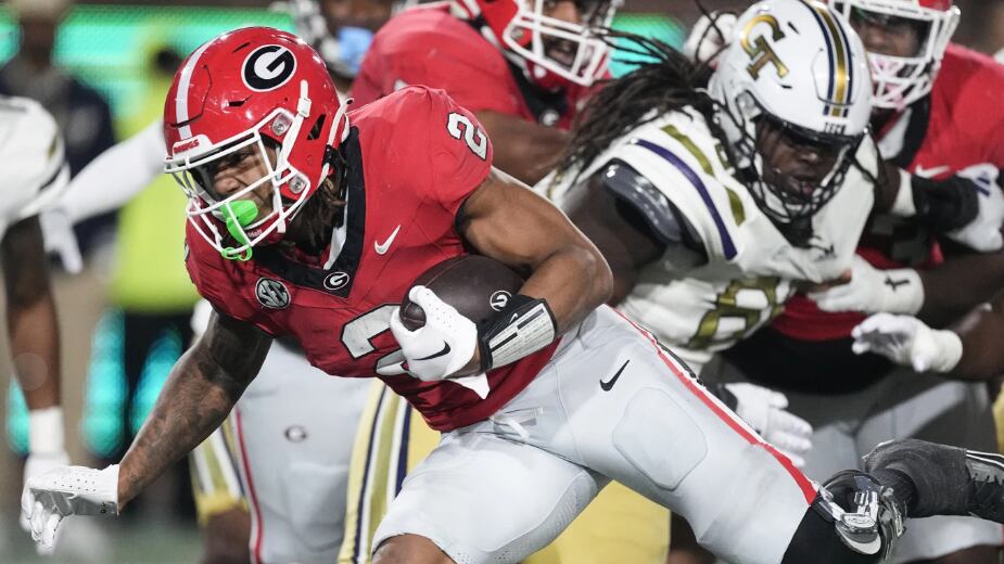 Georgia running back Kendall Milton (2) runs for a touchdown during the first half of an NCAA college football game against Georgia Tech, Saturday, Nov. 25, 2023, in Atlanta. (AP Photo/John Bazemore)