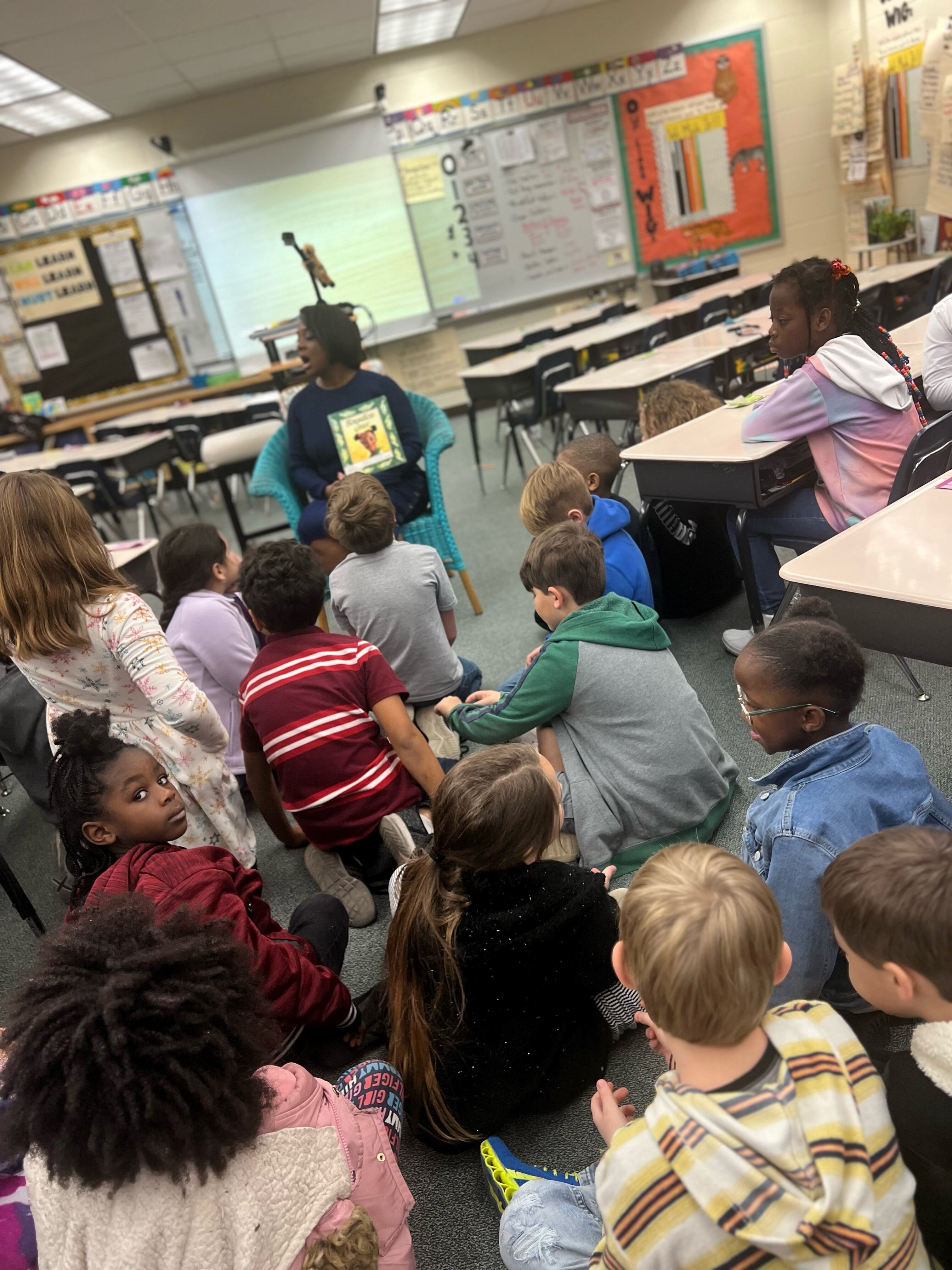 ANJ anchor Dawn Lopez reads 'Boundless Grace' to some focused students at Crown Pointe Elementary.