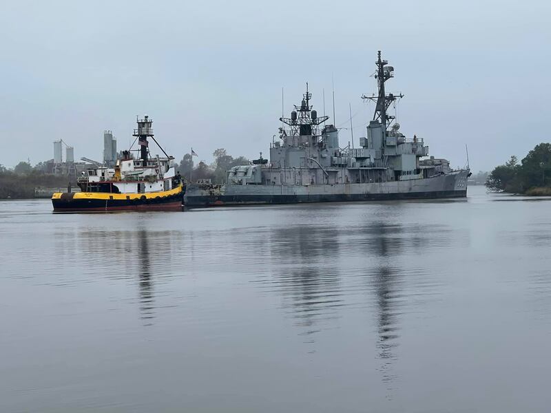 The Orleck Museum Ship being pulled away from her original home on the Calcasieu River in Lake Charles, Louisiana.