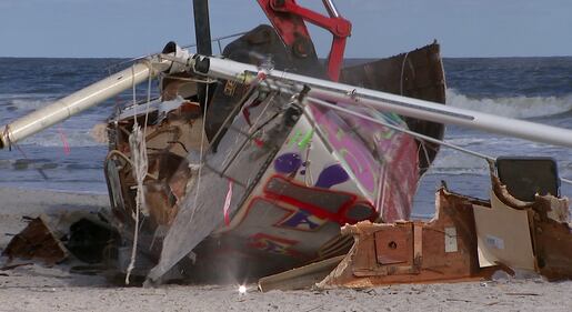 Crews came Tuesday to remove a sailboat that washed ashore on Jacksonville Beach in October.