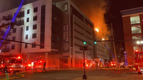 Jacksonville Fire and Rescue Department firefighters have been fighting a fire at the still-under-construction Rise Doro apartments in Downtown Jacksonville since Sunday night.