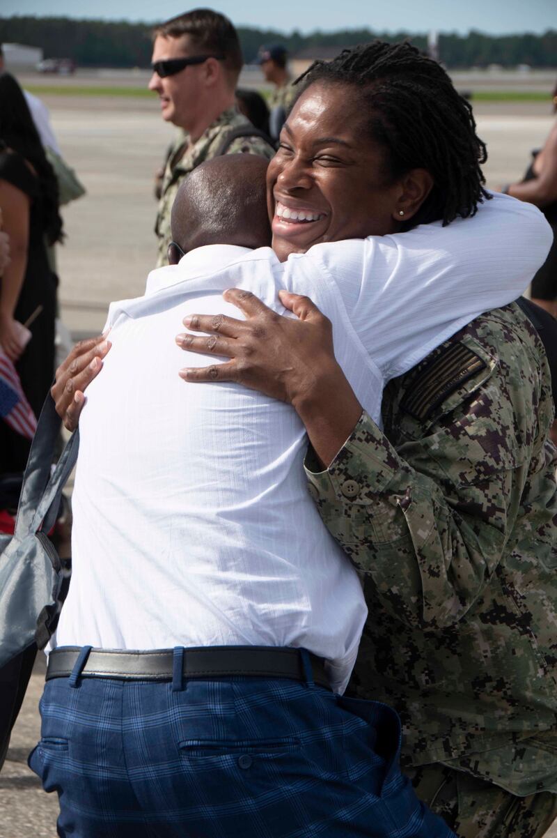 JACKSONVILLE, Fla. (Oct. 8, 2023) Logistics Specialist Chief Ayisha Ross embraces a loved one. Patrol Squadron Sixteen (VP) 16, returns home after a six month deployment to 7th Fleet. (U.S. Navy photo by: Mass Communication Specialist Second Class (NAC/AW) Mathew Lombardo)