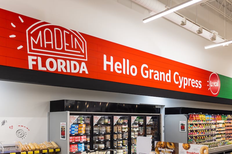 Ribbon cutting ceremony before the doors opened at Grand Cypress location on Wed., Dec. 14.