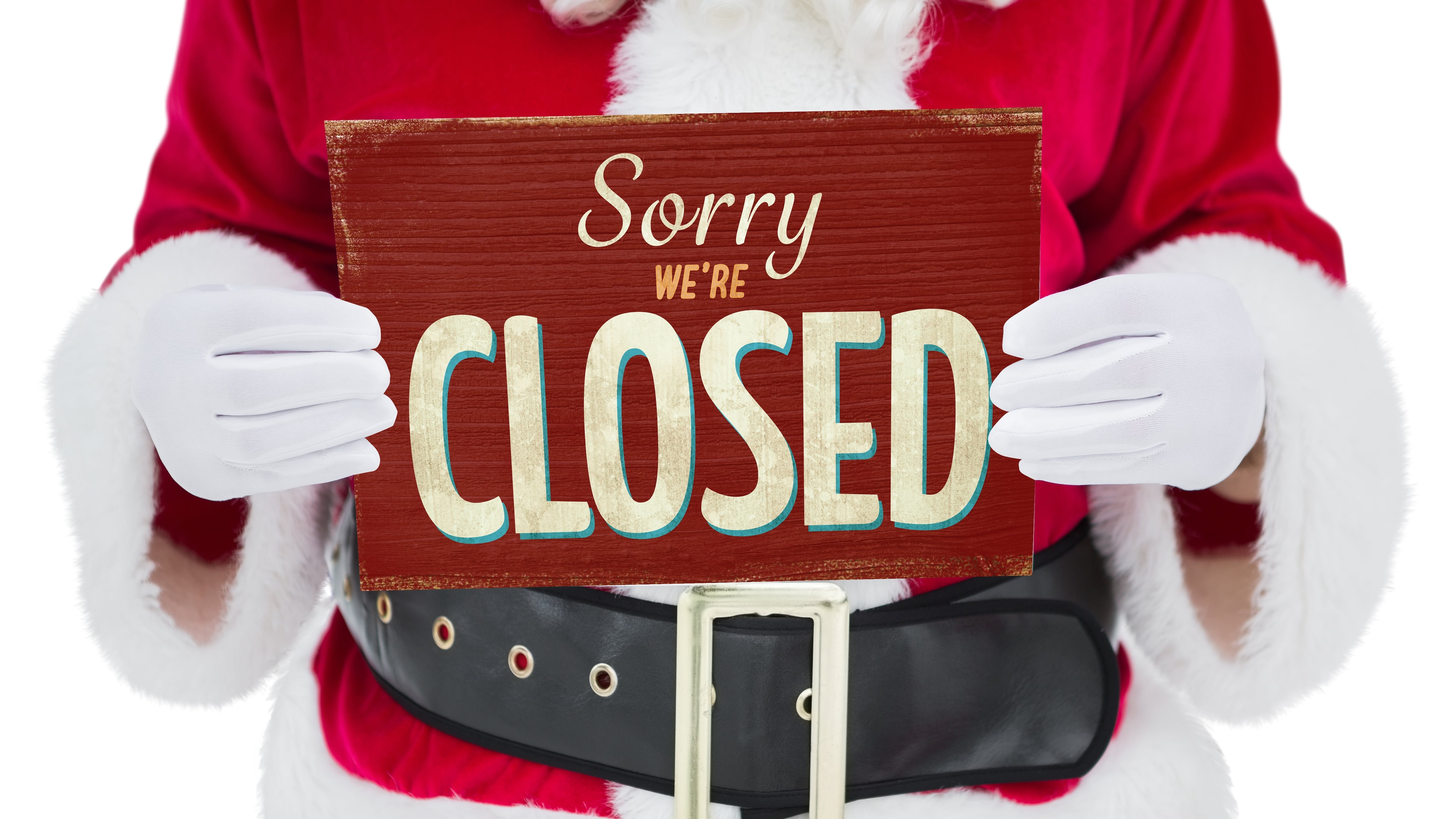 Santa holding closed sign