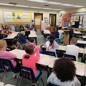 ANJ anchor Dawn Lopez reads 'Boundless Grace' to some focused students at Crown Pointe Elementary.