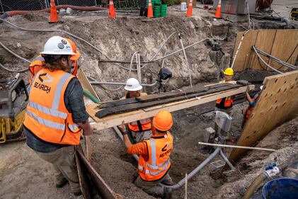 The archaeological team laid recovered planks on a stretcher of plywood to support the water-logged, easily broken wood as it was recovered intact and sent up to archaeological conservators for placement in fresh-water tanks for wet storage pending further analysis.