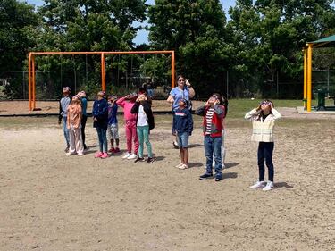 Students at Bartram Springs Elementary School take in the view of the 2024 solar eclipse.