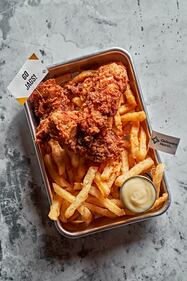 Fat Rooster Tenders: Fresh hand-breaded fried chicken tenders marinated in a house brine of hot sauce and buttermilk. Served with a side of honey mayo. Available at The Fat Rooster (lower level).