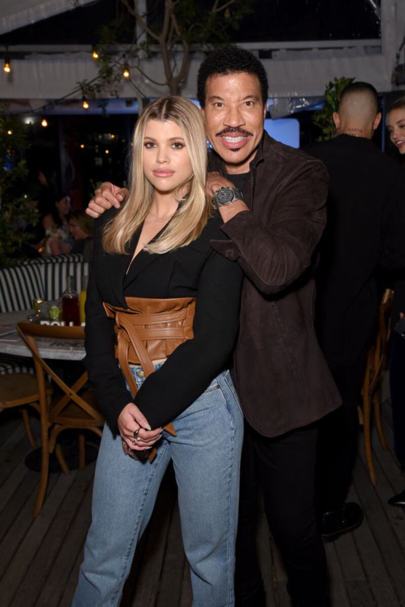 WEST HOLLYWOOD, CALIFORNIA - FEBRUARY 20: (L-R) Sofia Richie and Lionel Richie attend Rolla's x Sofia Richie Launch Event at Harriet's Rooftop on February 20, 2020 in West Hollywood, California. (Photo by Presley Ann/Getty Images for Rolla's)