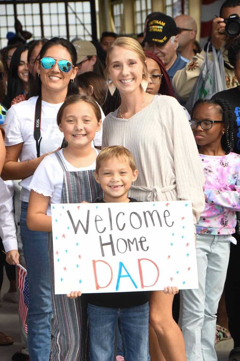 JACKSONVILLE, Fla. (Oct. 8, 2023) Family members wait for their sailors to return. Patrol Squadron Sixteen (VP) 16, returns home after a six month deployment to 7th Fleet. (U.S. Navy photo by: Mass Communication Specialist Second Class (NAC/AW) Mathew Lombardo)
