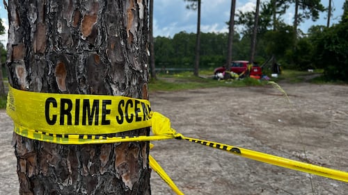 Crime scene tape can be seen at Gilligan's Island, in St. Marys, Ga.