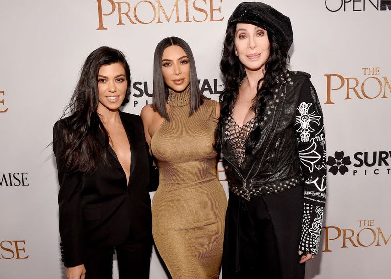 HOLLYWOOD, CA - APRIL 12:  TV personalities Kourtney Kardashian, Kim Kardashian West, and actor/singer Cher attend the premiere of Open Road Films' "The Promise" at TCL Chinese Theatre on April 12, 2017 in Hollywood, California.  (Photo by Kevork Djansezian/Getty Images)