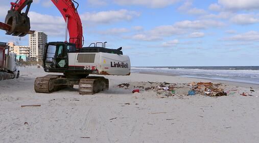 Crews came Tuesday to remove a sailboat that washed ashore on Jacksonville Beach in October.