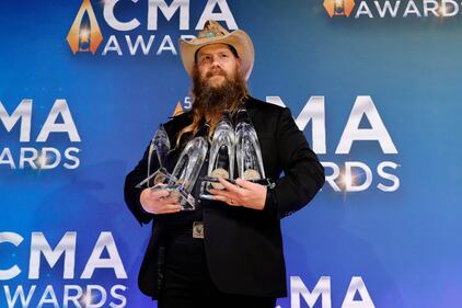NASHVILLE, TENNESSEE - NOVEMBER 10: Chris Stapleton poses with his awards for the 55th annual Country Music Association awards at the Bridgestone Arena on November 10, 2021 in Nashville, Tennessee. (Photo by Jason Kempin/Getty Images)