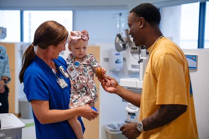 Etienne spent time with children at THE PLAYERS Center for cancer and blood disorders.