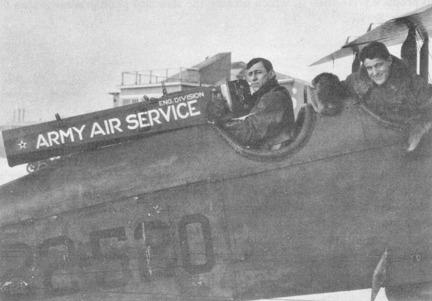 Sam M. Burka (left), a physicist at McCook Field, Ohio, rides with Lt. George W. Goddard to photograph the total solar eclipse Jan. 24, 1925. They were among 25 planes to observe; others were unable to take off due to the cold.