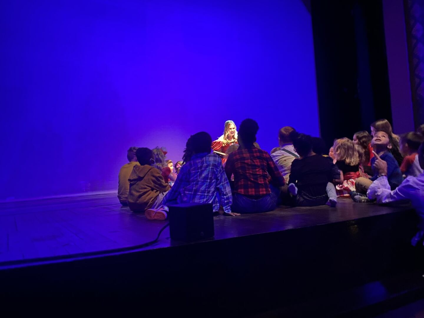 Chandler Morgan reads to kids at the Community Nutcracker
