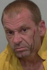 Adam Dicks, 44, is charged with resisting arrest after police said he was interfering with media covering an incident where a Lake City police officer was shot at an Easter event.