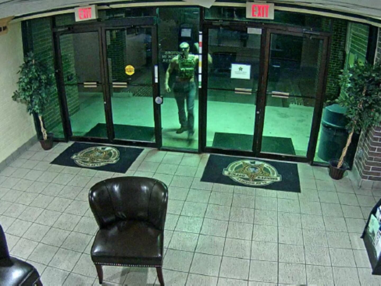 Former firefighter Zack Coon bangs on the entrance to Clay County Jail.