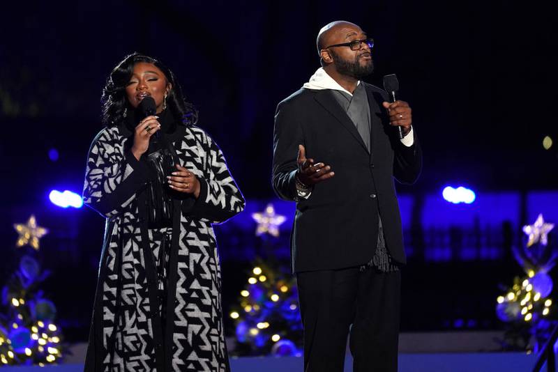 WASHINGTON, DC - NOVEMBER 30: Samara Joy and Antonio McLendon perform "The Christmas Song" during the Lighting Ceremony of the National Christmas Tree in President's Park in the Ellipse of the White House on November 30, 2023 in Washington, DC. High winds toppled the tree on Tuesday but workers were able to right the 40-foot Norway spruce, which was planted just two weeks ago to replace another tree, planted in 2021, that had developed a fungal disease. (Photo by Nathan Howard/Getty Images)